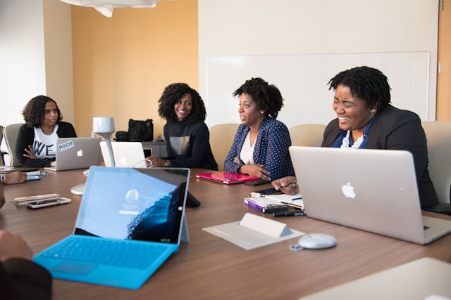 four women at a board meeting